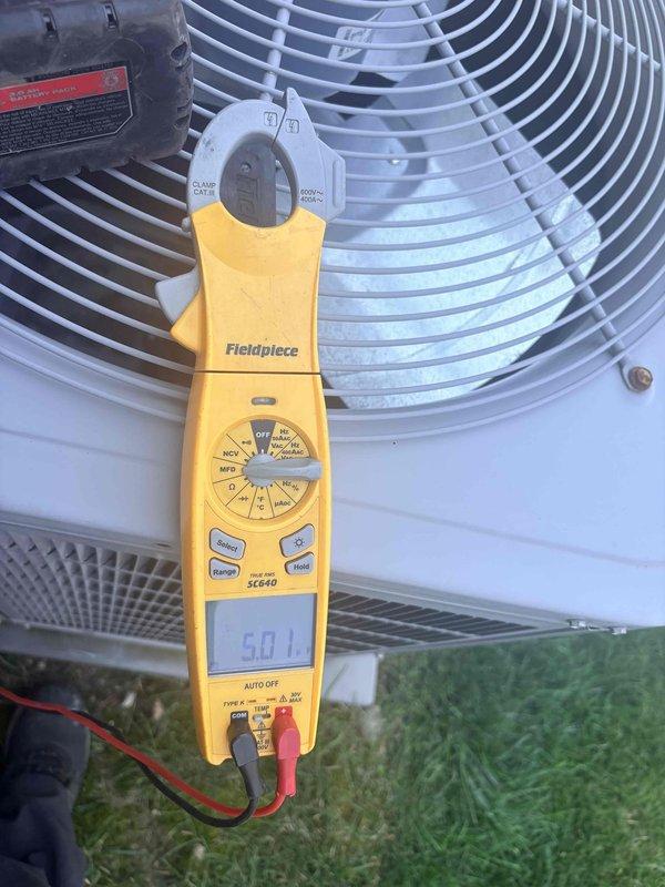 Completed scheduled cooling maintenance on residential air conditioning system. Performed comprehensive inspection of condenser unit, measuring compressor amperage at 5.0A and control voltage at 24.9V, both within normal operating parameters. Verified all electrical connections, inspected condenser coil and fan assembly, and confirmed system is operating properly with no deficiencies noted.