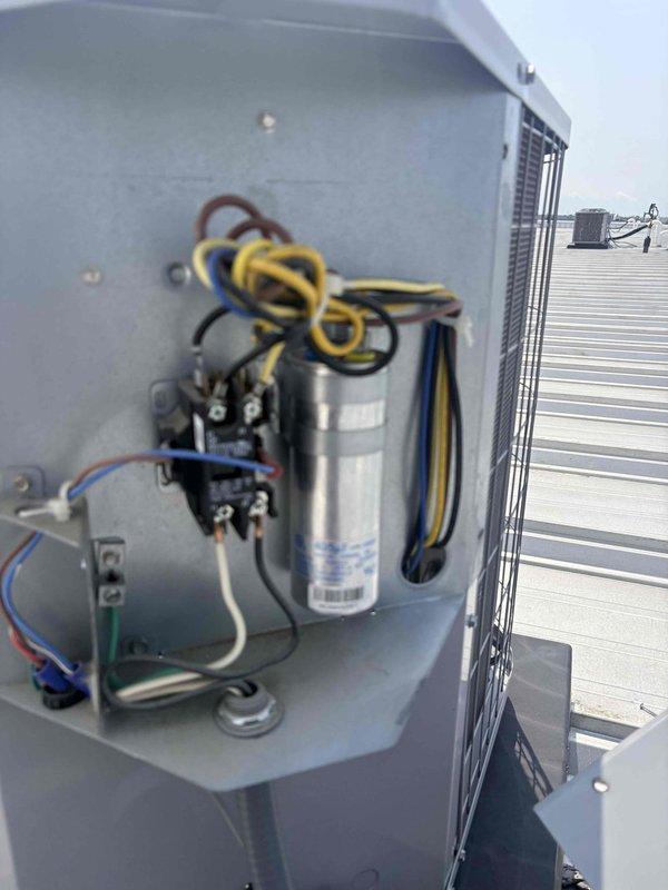 Completed scheduled preventative maintenance tune-up on commercial rooftop HVAC unit. Inspected electrical components including capacitor, contactor, and all wire connections; verified proper operation of control board and wiring harness. All components found in satisfactory working condition with no repairs required at this time.