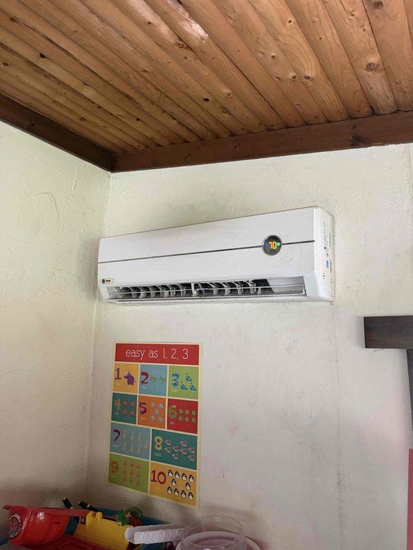 Responded to no cooling call on split system air conditioning unit. Upon arrival, inspected indoor wall-mounted evaporator unit and outdoor condensing unit. Performed diagnostic evaluation to identify cause of system failure. Assessed electrical components, refrigerant levels, and operational controls. Documented equipment condition through photographic evidence showing outdoor unit panel with wear consistent with normal operation and indoor unit installation in conditioned space. Determined root cause of cooling loss and provided customer with findings and repair options to restore system functionality.
