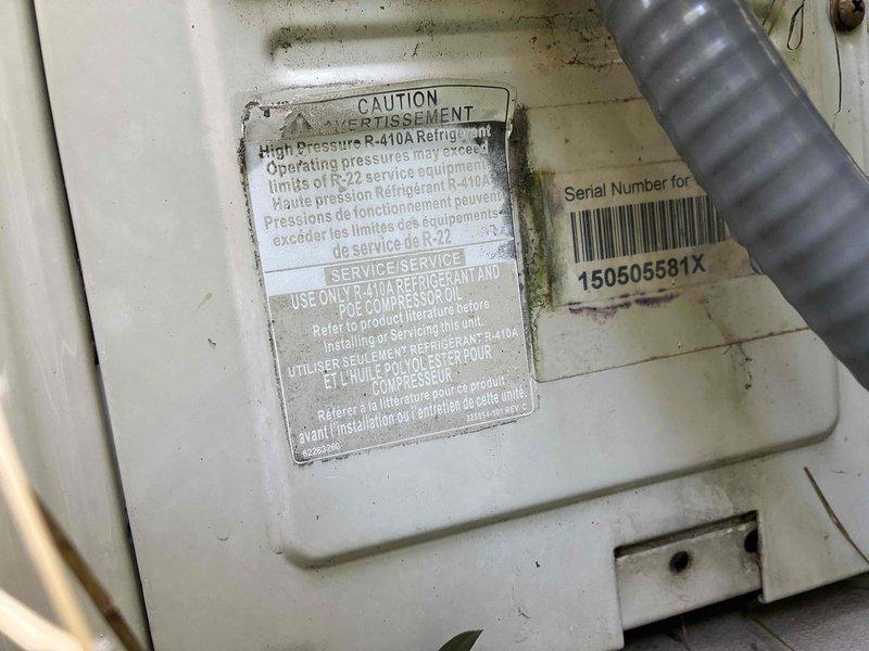 Responded to service call for non-operational mini-split system with no cooling capability. Performed diagnostic evaluation of ductless air conditioning unit utilizing R-410A refrigerant, inspected indoor wall-mounted evaporator and outdoor condensing unit components, and documented equipment condition including serial number for service records.