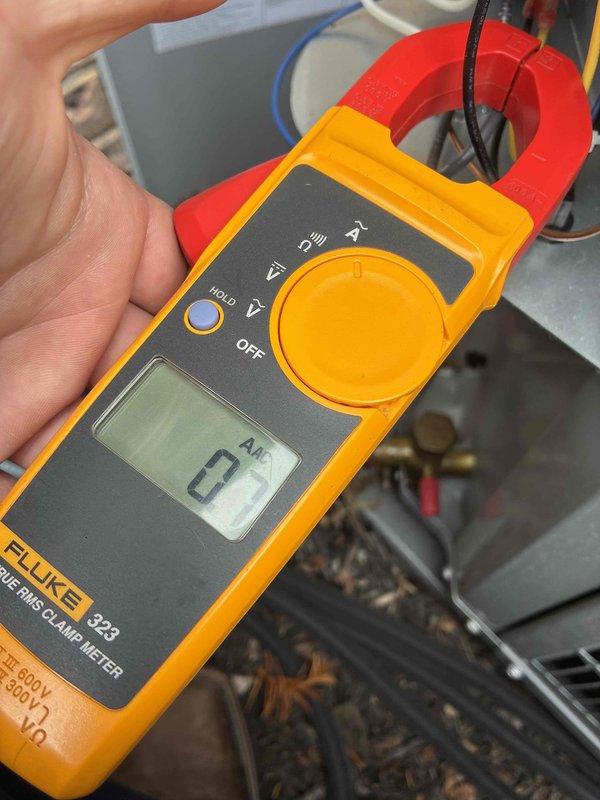 Completed scheduled cooling maintenance visit on residential HVAC system. Performed comprehensive system inspection and measured electrical current draw using clamp meter, recording 67 amps AC on compressor circuit to verify proper operating amperage within manufacturer specifications. All components found operating normally with no deficiencies noted.