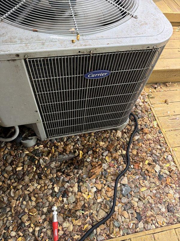 # HVAC Cooling System Maintenance

Completed scheduled cooling maintenance on residential Carrier air conditioning system. Performed comprehensive inspection of outdoor condenser unit and indoor air handler components. Indoor blower wheel showed significant dust and debris accumulation on fan blades, which was documented. Inspected condenser unit positioned on deck with gravel base - unit showed normal outdoor weathering with minor leaf accumulation in surrounding area. Verified structural integrity of both indoor and outdoor components, confirmed all protective grilles and fan guards were intact and secure. System components found to be mechanically sound and operational. Documented equipment condition through photographic records for maintenance history.
