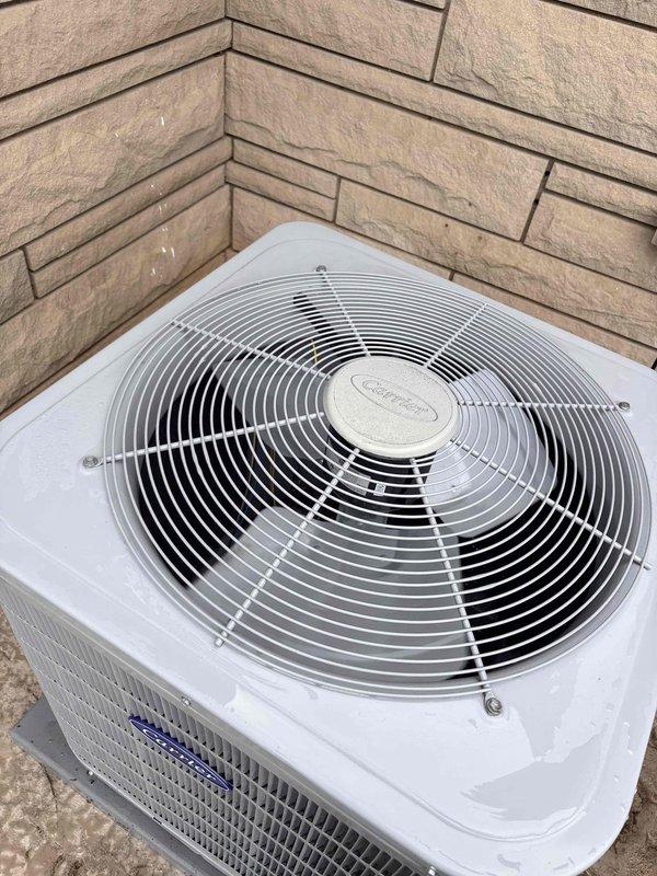 Completed scheduled cooling maintenance on residential HVAC system. Inspected outdoor condenser unit, confirmed proper fan operation and verified unit cleanliness with intact protective wire guard. Documented heavily soiled air filter with significant dust and debris accumulation, including dense particulate buildup restricting airflow, and recommended immediate replacement to restore proper system efficiency and indoor air quality.