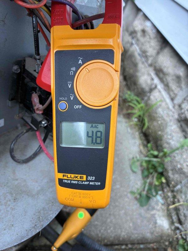 # HVAC Cooling System Maintenance

Completed scheduled preventive maintenance on residential cooling system. Performed comprehensive inspection of air handler unit and associated ductwork connections. Verified proper airflow through supply plenum and inspected all accessible duct joints for secure connections and proper sealing.

Conducted electrical diagnostics using calibrated clamp meter, measuring current draw at outdoor condensing unit. Recorded amperage reading of 4.8 AAC, indicating normal operating parameters within manufacturer specifications. Inspected all electrical connections at contactor and verified proper voltage supply to compressor circuit. All electrical components functioning within acceptable ranges with no signs of overheating or deterioration.

System operating efficiently with no deficiencies noted. Maintenance visit completed successfully.