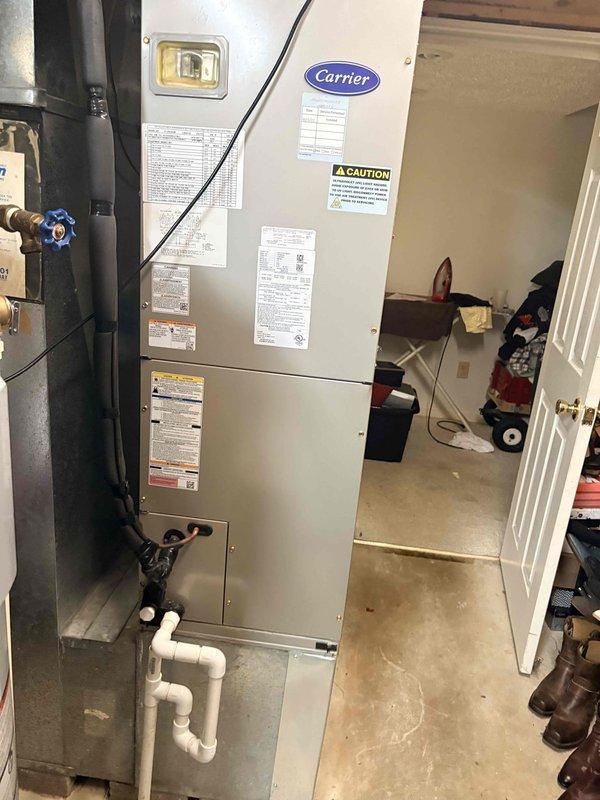 Completed monthly cooling maintenance on Carrier air handler unit located in mechanical room. Performed comprehensive system inspection including visual examination of cabinet, ductwork connections, and condensate drain lines with P-trap configuration. Conducted electrical diagnostics on outdoor condensing unit using digital multimeter, measuring voltage and amperage readings to verify proper system operation and component performance. All equipment operating within manufacturer specifications, safety labels intact, and system functioning normally.