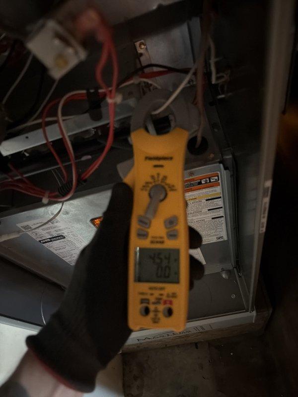 Performed scheduled cooling system maintenance on residential HVAC unit. Conducted comprehensive electrical diagnostics using digital multimeter on both indoor air handler and outdoor condensing unit, verifying proper voltage and amperage readings across all components. Inspected internal wiring connections, capacitors, and circuit board for proper operation and signs of wear. Removed outdoor unit access panel to access electrical compartment and test components. Cleared vegetation growth from base of outdoor unit that had accumulated around equipment. All electrical readings within manufacturer specifications. System operating normally upon completion of maintenance visit.