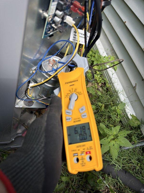 Performed scheduled cooling system maintenance on residential HVAC unit. Conducted comprehensive electrical diagnostics using digital multimeter on both indoor air handler and outdoor condensing unit, verifying proper voltage and amperage readings across all components. Inspected internal wiring connections, capacitors, and circuit board for proper operation and signs of wear. Removed outdoor unit access panel to access electrical compartment and test components. Cleared vegetation growth from base of outdoor unit that had accumulated around equipment. All electrical readings within manufacturer specifications. System operating normally upon completion of maintenance visit.