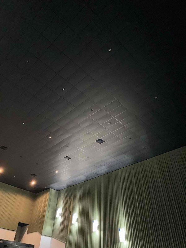 Completed ductwork modification project involving relocation of two ceiling grilles and rerouting of approximately 50 linear feet of ductwork in commercial interior space. Work performed on facility with acoustic tile ceiling and required coordination for site access. HVAC condenser unit inspected and confirmed operational following ductwork modifications.