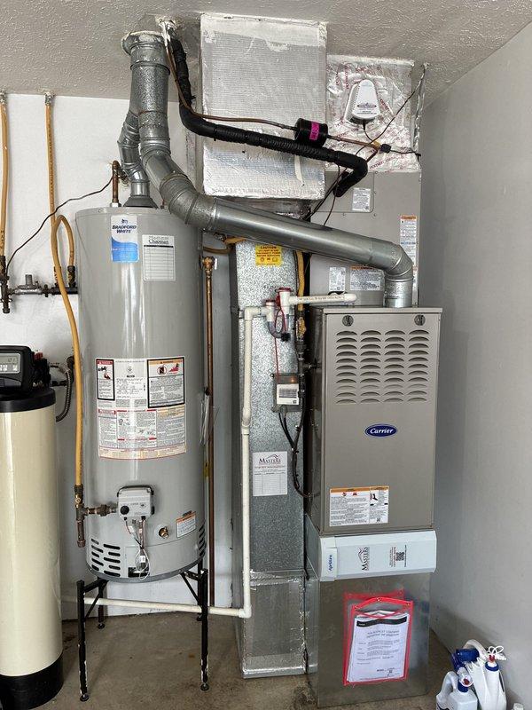 Completed full HVAC system installation in residential utility room, replacing existing equipment with Carrier Performance Series components. Installed Carrier 26TPA836W003 two-stage air conditioner (16 SEER), CVAVA4217XMA evaporator coil, and 58TP0B070V17--16 two-stage non-condensing gas furnace (70,000 BTU). Connected refrigerant lines, installed and insulated ductwork, verified electrical connections, and integrated system with existing digital thermostat. Performed startup procedures, checked airflow and temperature differential, tested two-stage operation on both heating and cooling modes, and confirmed proper system cycling. Documented equipment serial numbers for warranty registration and verified all safety controls functioning properly.