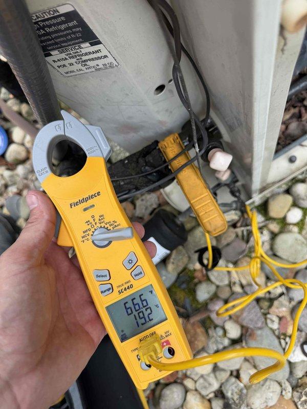 # No Cooling - Bedroom Unit

Responded to no cooling complaint on bedroom mini-split system. Upon arrival, found unit running but failing to maintain setpoint temperature. Connected manifold gauges to service ports and verified refrigerant pressures and temperatures. System showed low suction pressure indicating potential refrigerant undercharge or restriction. Used clamp meter to measure compressor amperage draw, recording 19.2 amps, which fell below manufacturer specifications for ambient conditions. Diagnosed system as undercharged due to refrigerant leak. Recommended leak detection service and proper refrigerant recharge to restore cooling capacity. Unit left in current operating state pending customer approval for additional repairs.