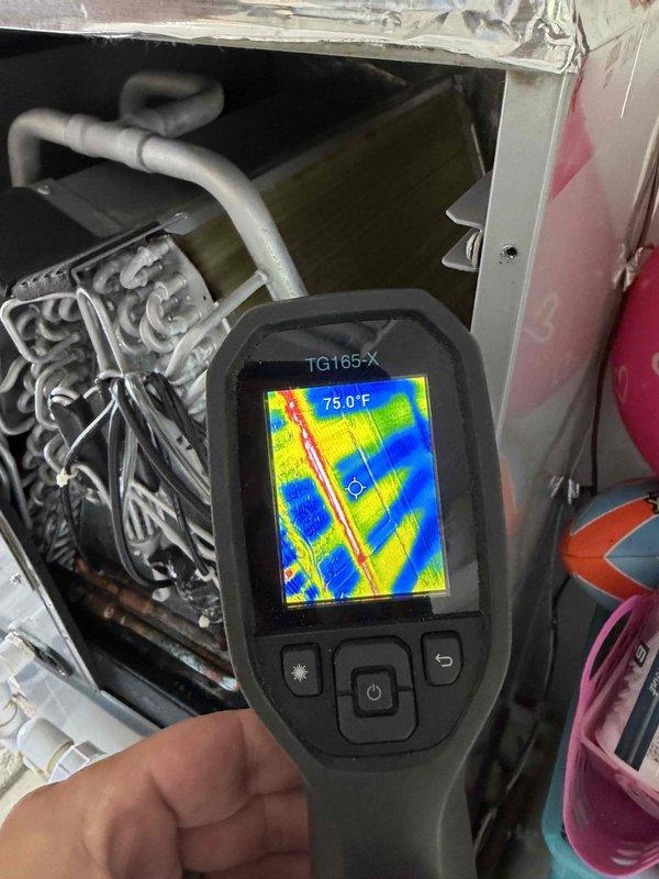 Returned to site with thermal imaging camera to inspect evaporator coil for hot spots as requested. Performed thermal scan of coil assembly and surrounding components, recording temperature readings ranging from 71.7°F to 75.0°F across the coil surface. Based on thermal imaging results, verified coil condition and determined no significant temperature anomalies or hot spots present that would indicate immediate repair needs.