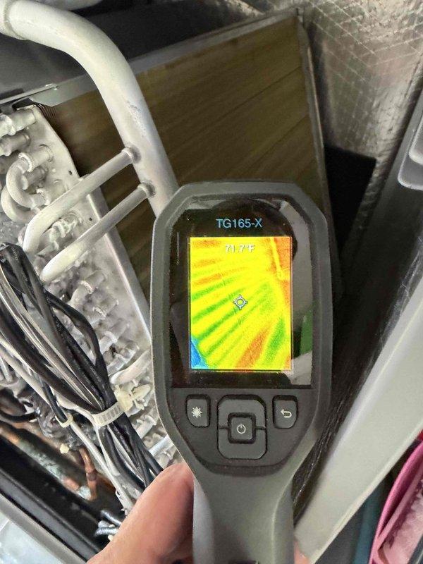 Returned to site with thermal imaging camera to inspect evaporator coil for hot spots as requested. Performed thermal scan of coil assembly and surrounding components, recording temperature readings ranging from 71.7°F to 75.0°F across the coil surface. Based on thermal imaging results, verified coil condition and determined no significant temperature anomalies or hot spots present that would indicate immediate repair needs.