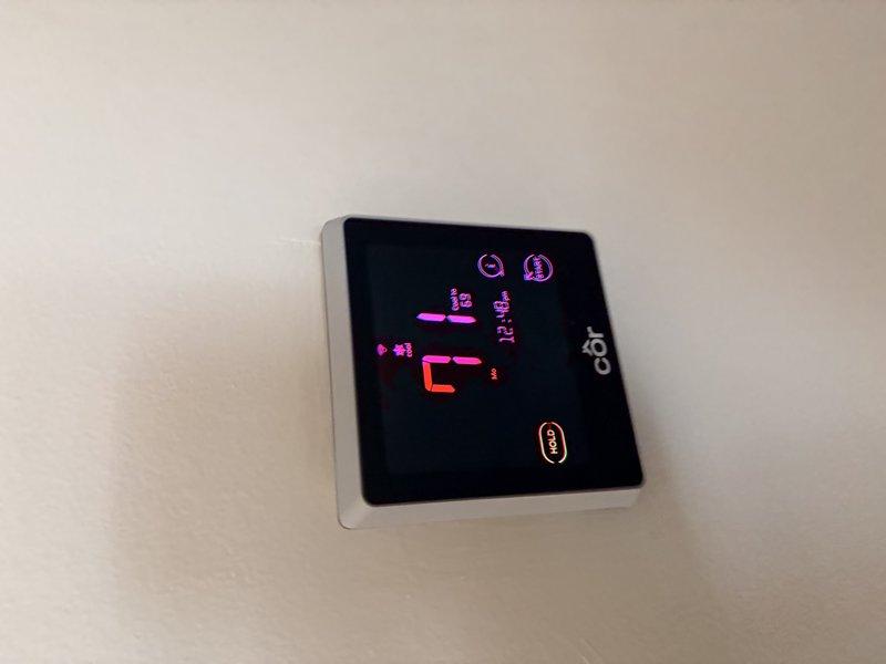 Performed comprehensive cooling system maintenance on residential air conditioning unit. Conducted electrical diagnostics using digital multimeter, recording voltage reading of 33.5V at outdoor condenser unit. Verified thermostat operation and system controls, confirmed proper communication between indoor Cor smart thermostat and outdoor equipment, and completed standard preventive maintenance procedures to ensure optimal cooling performance for the upcoming season.