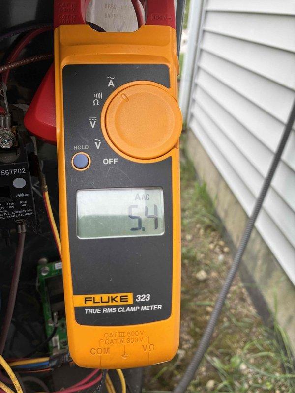 # HVAC Cooling System Maintenance Completed

Performed comprehensive cooling system maintenance on residential air conditioning unit. Conducted electrical diagnostics using Fluke 323 True RMS clamp meter, measuring compressor amperage at 5.4 amps AC to verify proper operation within manufacturer specifications. Inspected evaporator coil assembly (Model A0B5053TSAA) within air handler unit, confirming coil integrity and proper refrigerant line connections. All system components found operating within normal parameters. Unit cleared for continued seasonal operation.
