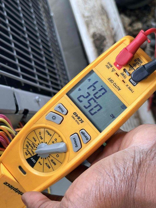 Completed annual cooling maintenance on residential air conditioning system. Performed comprehensive inspection of outdoor condensing unit, verified electrical readings using digital multimeter showing proper voltage and amperage within manufacturer specifications. Inspected internal wiring connections, motor components, and capacitor assembly to ensure all electrical connections were secure and operating safely. All system components found to be functioning properly with no deficiencies noted.