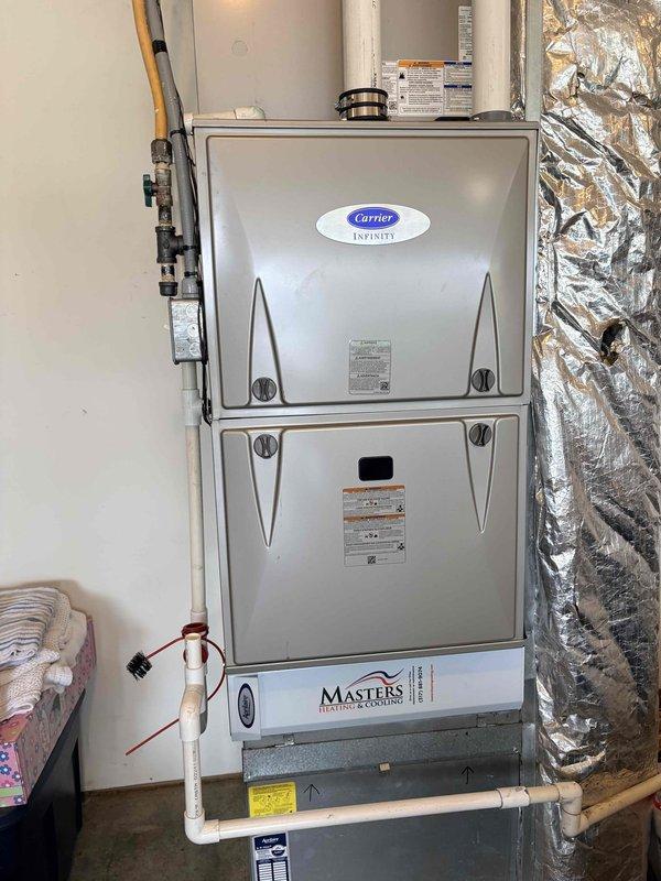 Completed annual cooling maintenance on Carrier Infinity system. Inspected air handler unit, verified proper operation of all components, checked refrigerant lines and gas connections for integrity, and measured supply air temperature at 98.5°F. All ductwork insulation, condensate drain lines, and system components found in good operating condition with no deficiencies noted.