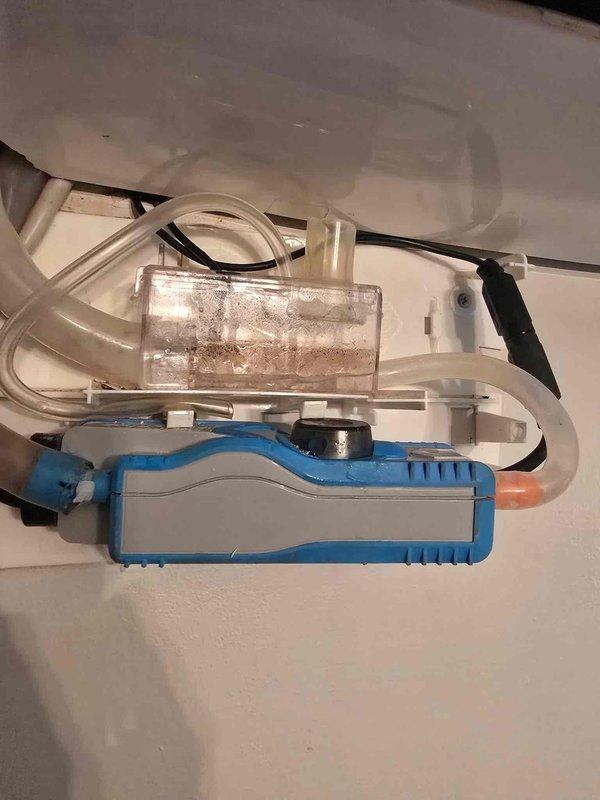 Responded to no-cool complaint on upstairs mini-split system with water leak causing damage to carpet. Upon inspection, found condensate pump failure with clogged reservoir and malfunctioning float switch preventing proper drainage. Removed pump assembly, cleaned debris from reservoir chamber, verified overflow safety switch operation, and tested all drain lines for proper flow. System restored to normal operation with condensate draining correctly and cooling function verified.