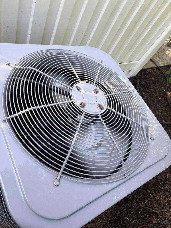 Completed comprehensive air conditioning tune-up on residential outdoor condenser unit, performing full preventative maintenance protocol including inspection of fan motor assembly, verification of wire guard integrity, cleaning of condenser coils, and system performance evaluation. Discussed and enrolled homeowner in ongoing maintenance plan to ensure continued system reliability and efficiency. Unit operating within normal parameters upon completion with all components functioning properly.