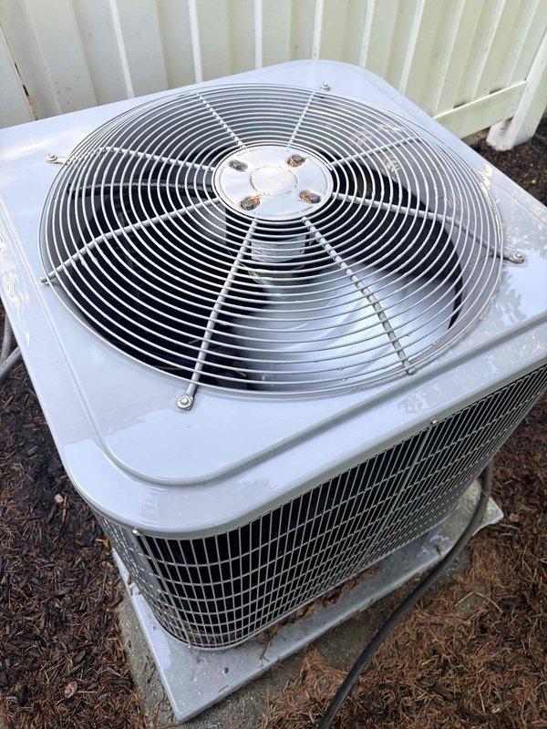Completed comprehensive air conditioning tune-up on residential outdoor condenser unit, performing full preventative maintenance protocol including inspection of fan motor assembly, verification of wire guard integrity, cleaning of condenser coils, and system performance evaluation. Discussed and enrolled homeowner in ongoing maintenance plan to ensure continued system reliability and efficiency. Unit operating within normal parameters upon completion with all components functioning properly.