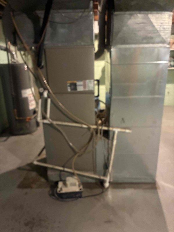 Responded to flood-damaged furnace inspection request following basement water damage exceeding three feet. Conducted thorough assessment of Bryant furnace unit, air handler, and associated HVAC components including PVC venting, ductwork connections, and electrical systems. Documented equipment condition with photographs showing water line impact on mechanical systems and provided customer with comprehensive evaluation for repair versus replacement options.