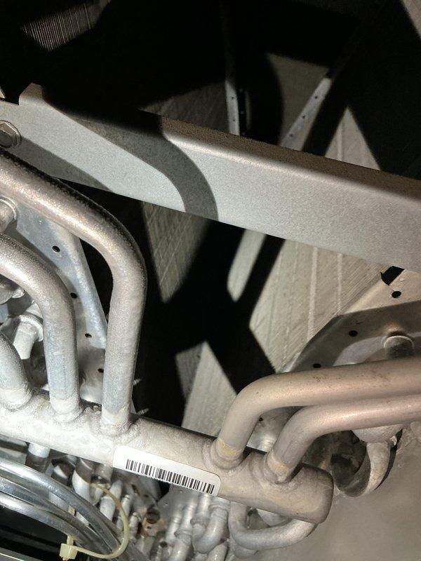 Completed preventative maintenance tune-up on residential HVAC system as part of promotional service award. Performed standard inspection of evaporator coil assembly, documented coil condition and heat exchanger components with photographs, and verified proper operation of all accessible system components during scheduled appointment window.