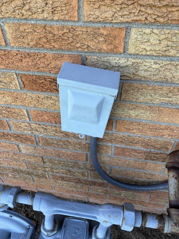 Responded to commercial no cooling call where building temperature was 75° with thermostat set to 70°. Upon arrival, confirmed system was running but not producing cold air. Performed diagnostic evaluation of outdoor condenser unit, measuring discharge air temperature at 135.5° at the fan grille, indicating compressor operation. Inspected electrical connections at exterior junction box and refrigerant line set. System requires further troubleshooting to identify root cause of insufficient cooling capacity.