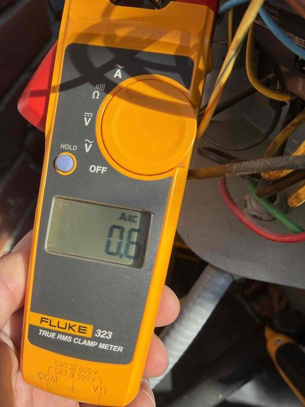 Completed scheduled preventive cooling maintenance on HVAC system. Performed electrical diagnostics using clamp meter to verify proper amperage draw and system performance. Measured supply air temperature at evaporator coil, recording 12.5°F temperature differential indicating adequate cooling capacity and proper refrigerant charge. Inspected evaporator coil condition, noting moisture present from normal condensation during operation, confirming active cooling cycle and proper drainage function.