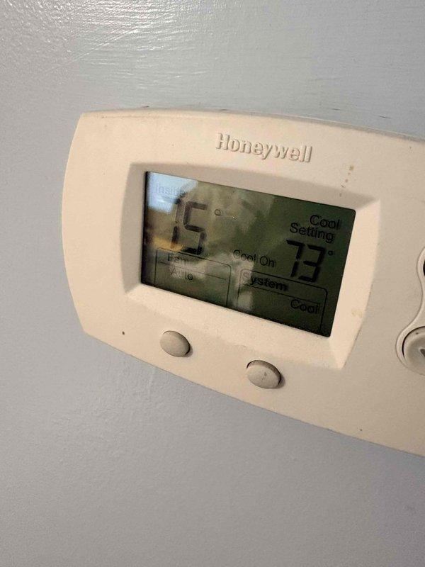 Responded to no cooling call and performed diagnostic evaluation of residential air conditioning system. Verified thermostat operation showing 75°F setpoint in cooling mode with system actively running. Measured supply air temperature at ductwork registering 79.5°F, indicating insufficient cooling performance requiring further system assessment and potential refrigerant charge verification or compressor evaluation.