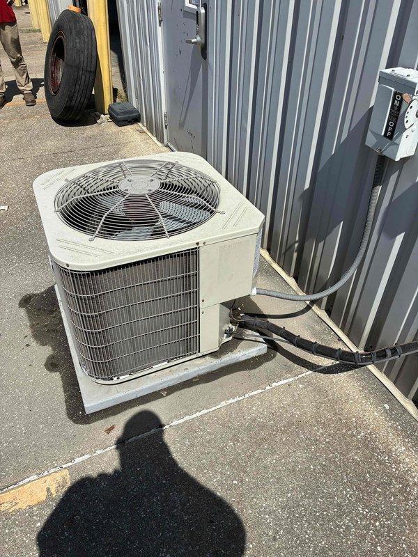 Conducted site assessment for commercial HVAC equipment replacement at outdoor and indoor locations. Evaluated existing weathered outdoor condenser unit with deteriorating exterior surfaces and aging indoor furnace system with associated ductwork and electrical components. Documented current equipment conditions, electrical connections, refrigerant lines, and installation configurations to prepare comprehensive replacement specifications for complete system upgrade.