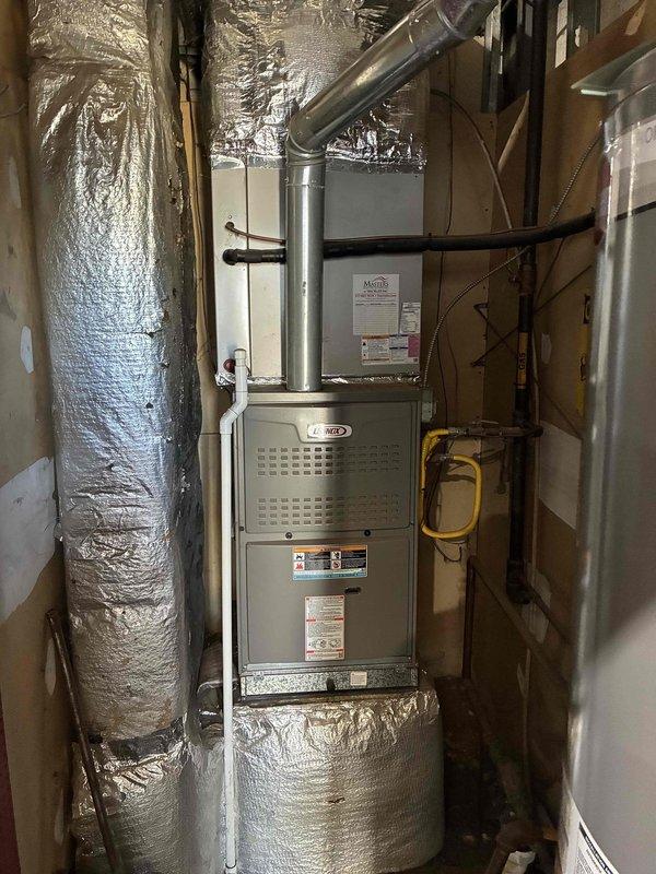 Conducted site assessment for commercial HVAC equipment replacement at outdoor and indoor locations. Evaluated existing weathered outdoor condenser unit with deteriorating exterior surfaces and aging indoor furnace system with associated ductwork and electrical components. Documented current equipment conditions, electrical connections, refrigerant lines, and installation configurations to prepare comprehensive replacement specifications for complete system upgrade.