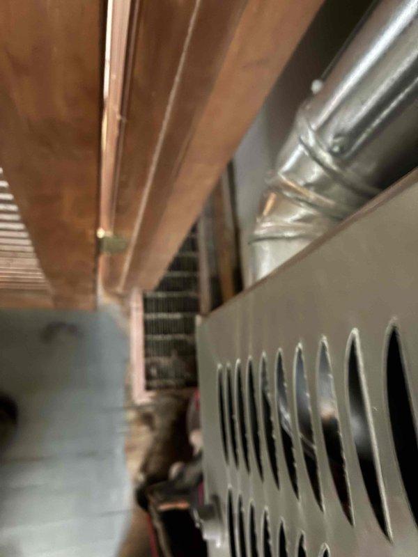 Responded to service call for intermittent cooling issues on LG system where indoor temperature reached 75° despite thermostat set to 66°. Upon arrival, contacted homeowner 30 minutes prior as requested and proceeded with diagnostic evaluation of the HVAC system. Conducted thorough inspection of indoor air handler unit located in mechanical space, examining evaporator coil, blower assembly, and associated ductwork. Verified thermostat settings and operation, checking for proper communication between thermostat and system components. Inspected outdoor condensing unit for proper operation, refrigerant levels, and electrical connections. Evaluated system cycling patterns to identify potential causes of intermittent cooling failure. Documented equipment condition through photographic evidence showing indoor unit installation, ductwork configuration, and mechanical room layout. System operational at time of inspection, requiring monitoring for intermittent failure patterns previously report