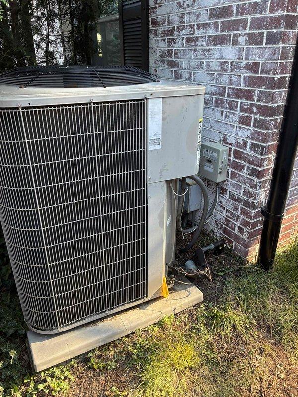 Responded to after-hours no cooling call for system evaluation and replacement estimate. Upon arrival, assessed existing outdoor condensing unit and indoor air handler installation. Took detailed measurements of existing ductwork and clearances in mechanical space, measuring between 25-29 inches to verify compatibility for new equipment installation. Documented current system configuration including refrigerant line routing, electrical disconnect location, and unit placement on concrete pad adjacent to brick exterior wall. Evaluated existing infrastructure including flexible ductwork connections and copper refrigerant lines. Provided comprehensive replacement estimate for complete HVAC system upgrade to restore cooling functionality to the residence.