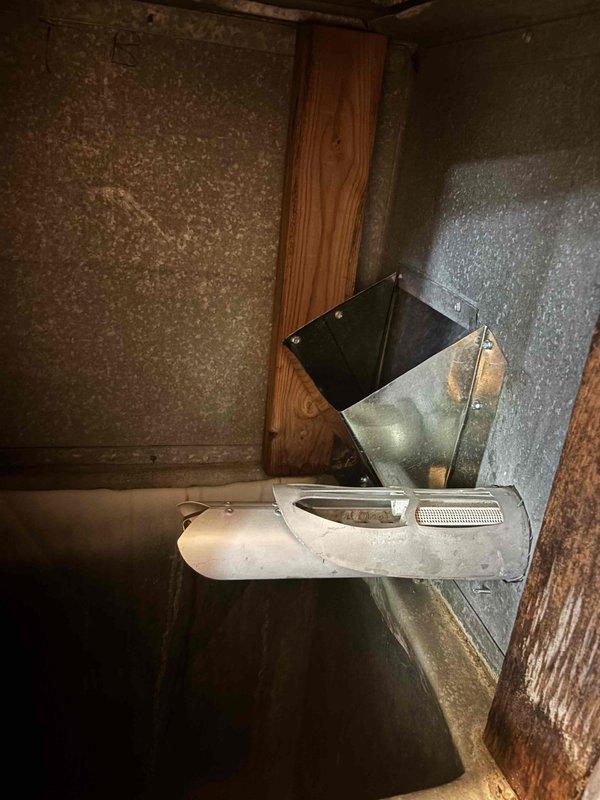 Completed warranty installation of a 3-inch return air scoop for the upstairs HVAC system. The scoop was properly mounted to the existing ductwork and secured to the wooden framing members in the attic space. All connections were verified for proper airflow and the installation was completed per manufacturer specifications.