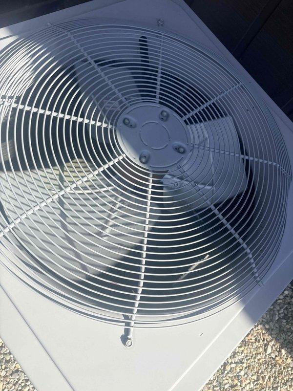 Performed scheduled preventative maintenance tune-up on residential air conditioning condenser unit. Conducted comprehensive system inspection including electrical testing with digital multimeter to verify proper voltage and amperage readings, inspected condenser fan operation and motor function, examined fan grille and housing for damage or debris, and confirmed unit cleanliness and overall operational status. System found to be in good working condition with no immediate repairs required.