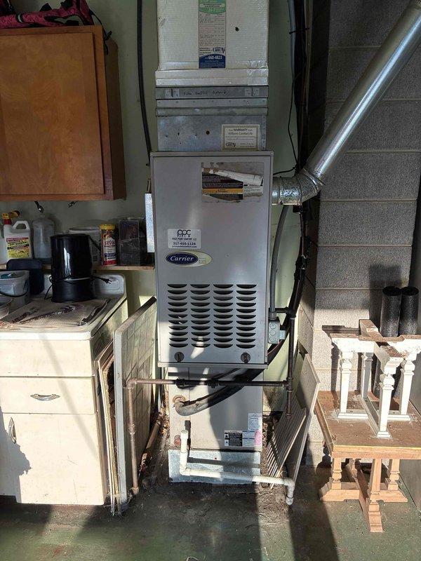 Completed full HVAC system replacement for 2013 Carrier unit located in basement utility area. Removed existing furnace and associated ductwork, installed new heating and cooling equipment with proper ventilation connections. Performed roof penetration work to accommodate new vertical venting system, securing metal ductwork with appropriate fasteners and weatherproofing around roofing surface. System tested and operational upon completion.