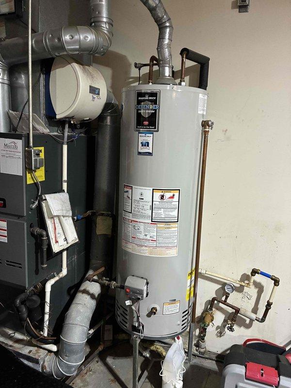 Conducted on-site assessment of existing HVAC system and water heater for complete system replacement estimate. Documented current equipment configuration including furnace, humidifier, water heater, ductwork, and dual thermostat setup (digital Honeywell and analog unit) to provide comprehensive replacement proposal for full system upgrade.