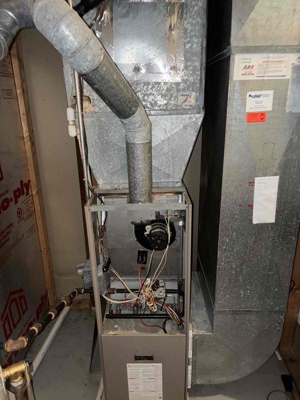 Performed comprehensive site evaluation for complete HVAC system replacement on residential property referred through Duke Energy partnership. Assessed existing furnace and air handler equipment located in basement utility area, documenting current system configuration including ductwork connections, gas line installations, and electrical components. Measured clearances and existing infrastructure to determine proper equipment sizing and installation requirements for proposed full system replacement.