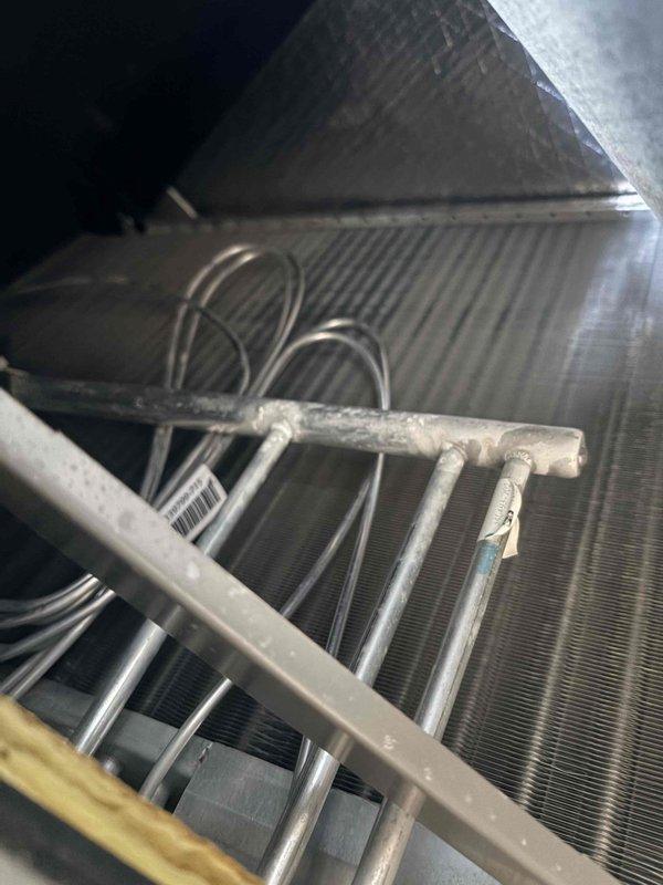Completed comprehensive tune-up on HVAC system including inspection of evaporator coil, refrigerant lines, and ductwork. Replaced Aprilaire filter and verified all electrical connections and system components are operating within normal parameters. System tested and confirmed functioning properly with no issues identified.