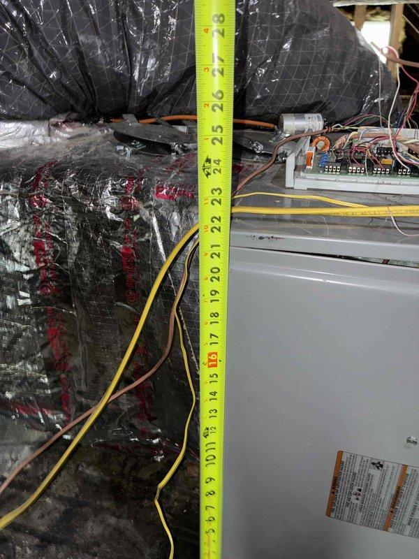 Conducted on-site estimate for complete furnace replacement and ductwork system replacement at rental property. Performed detailed measurements of existing HVAC system clearances and access points, documenting current equipment dimensions and available installation space. Assessed existing insulated ductwork condition and measured vertical and horizontal clearances for new equipment installation, noting electrical connections and control components requiring modification or replacement during system upgrade.