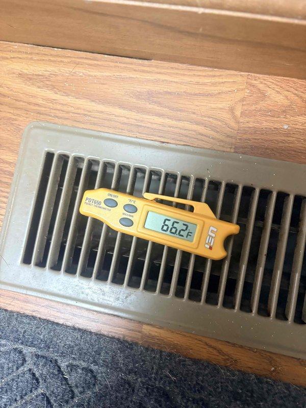 Responded to no cooling call following power outage with thermostat displaying no power. Upon arrival, found thermostat non-responsive and system not operating. Verified supply register temperature at 66.2°F with room temperature at 81°F, indicating system cooling capability once power restored. Checked thermostat wiring connections, reset breaker, and restored power to thermostat. Thermostat powered on successfully and system began operating in cooling mode with setpoint programmed to 70°F. Verified proper system operation and cooling delivery at supply registers.