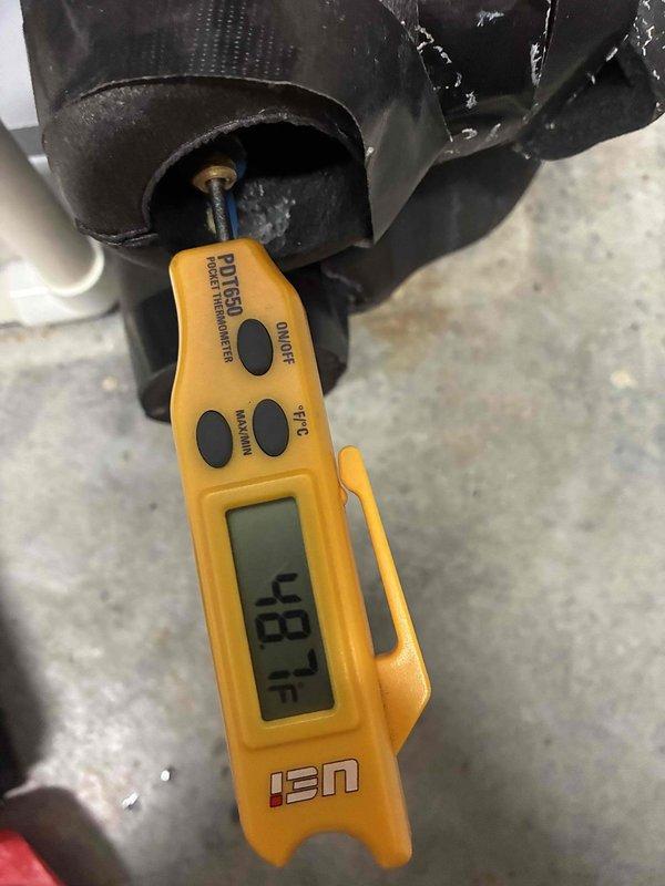 Performed comprehensive tune-up on 4-year-old furnace located in basement. Conducted standard maintenance procedures including temperature measurements of supply air (87°F recorded), inspected heat exchanger coil condition, verified refrigerant line connections and securing, and assessed overall system operation. System found to be functioning properly with no deficiencies noted; all components operating within normal parameters.