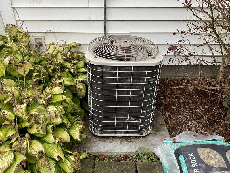 Completed full system replacement estimate for 28-year-old HVAC system. Existing outdoor condenser unit with cylindrical housing and foundation vent were documented and assessed for replacement specifications. Updated pricing provided to proceed with complete system replacement, as previous estimate from 2019 required revision for current equipment and labor rates.