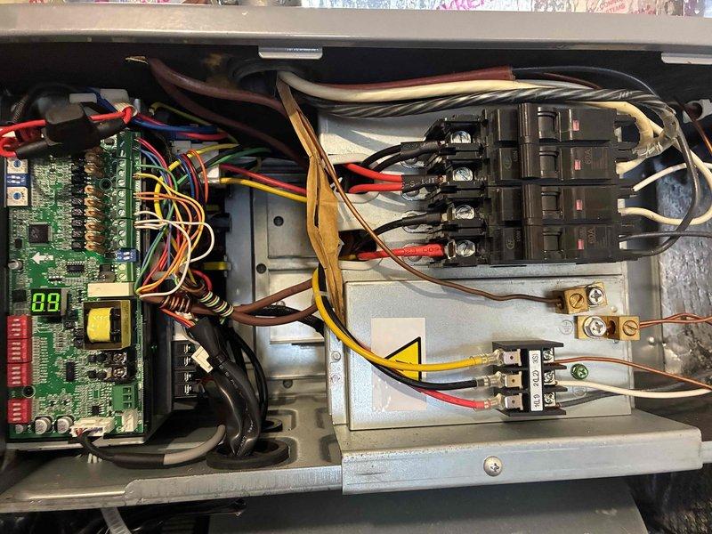 Completed comprehensive 2026 heating maintenance first service on residential HVAC system. Performed electrical diagnostics using clamp meter, recording 411 AAC amperage reading to verify proper system operation and current draw within manufacturer specifications. Inspected control board circuitry, verified all terminal connections, assessed circuit breaker functionality, and confirmed all wiring connections were secure throughout the electrical control panel. System operating normally with all components functioning as designed.