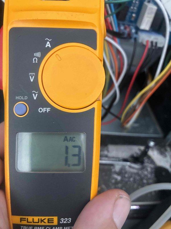 Completed scheduled heating maintenance on HVAC system. Performed comprehensive system diagnostics using Fluke 116 True RMS multimeter and Fluke 323 True RMS clamp meter to verify proper electrical operation. Measured amperage draw at 13 amps AC on system components and tested control board connections. Inspected all electrical connections, including bundled wire harnesses with proper color-coded wiring configuration. Verified voltage readings and system functionality across all heating components. All measurements within manufacturer specifications. System operating normally with no issues detected. Unit ready for heating season operation.