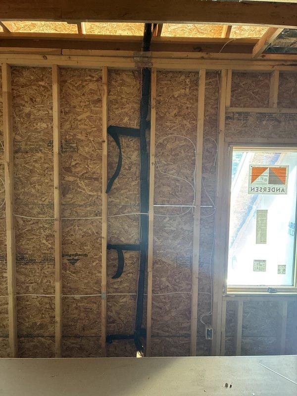 Completed dryer vent repair by sealing missing joints with foil tape and installing additional metal strapping between existing supports to ensure proper ventilation system stability and code compliance. All connections were secured and tested for proper airflow.