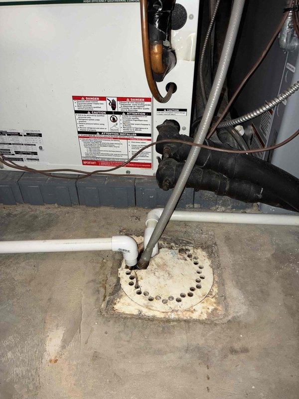 Conducted on-site assessment of existing geothermal heat pump system for replacement estimate. Evaluated current unit dimensions, mechanical components, refrigerant line configuration, and drainage system in utility area. Documented equipment specifications and installation requirements through measurements and photographic records to prepare comprehensive replacement proposal.