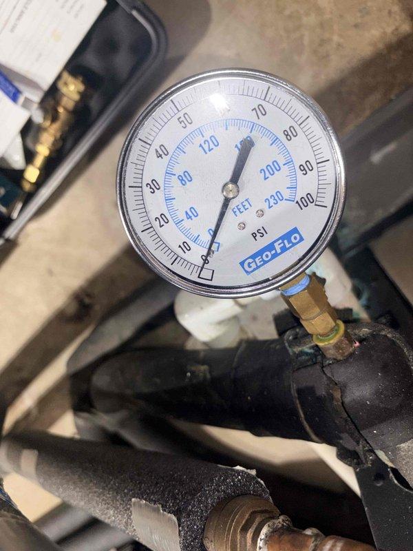 Completed scheduled cooling season maintenance on geothermal heat pump system. Inspected GEO-FLO pressure gauge and verified system pressures within normal operating range. Examined air handler, ductwork connections, and control components in basement mechanical area, confirming all equipment operating properly with no issues identified.