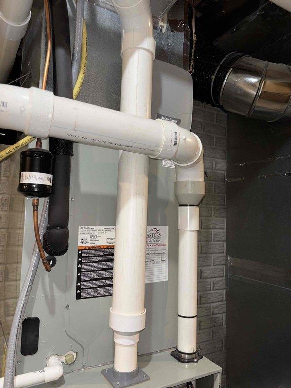 Responded to callback for water intrusion into furnace that persisted after previous repair of loose fitting. Upon inspection, identified ongoing condensate drainage issue affecting furnace cabinet. Inspected all PVC condensate drain lines, fittings, and connections throughout the system. Verified proper drainage flow, secured all condensate line connections, and ensured trap functionality. Tested system operation and confirmed no further water leakage into furnace cabinet.