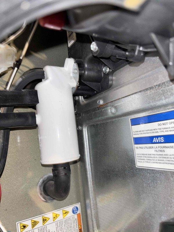 Responded to callback for water intrusion into furnace that persisted after previous repair of loose fitting. Upon inspection, identified ongoing condensate drainage issue affecting furnace cabinet. Inspected all PVC condensate drain lines, fittings, and connections throughout the system. Verified proper drainage flow, secured all condensate line connections, and ensured trap functionality. Tested system operation and confirmed no further water leakage into furnace cabinet.