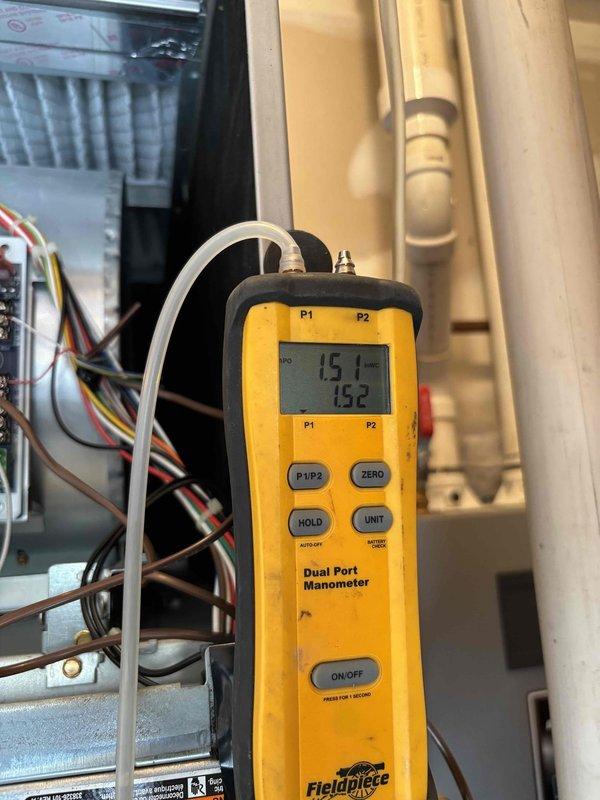 Completed annual preventative maintenance on 4-year-old furnace system. Performed comprehensive tune-up including inspection of blower motor assembly, control boards, and electrical connections. Measured gas pressure readings at 15.1 and 15.2 using dual port manometer to verify proper system operation. Inspected air filter, wiring harness, and all internal components. System operating within normal parameters with no deficiencies noted.